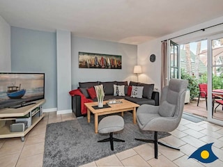 Wohnzimmer mit Zugang zur Terrasse