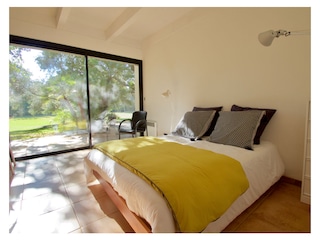 2nd bedroom with double bed & doors to garden