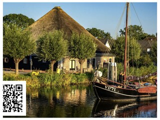 Traditionelles Haus am Flussufer