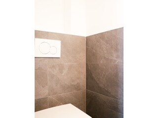 Extra toilet in the bedroom with high-quality slate