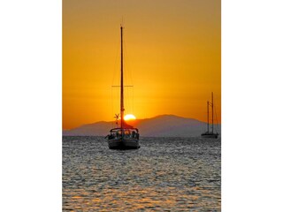 Boat on the beach at sunset