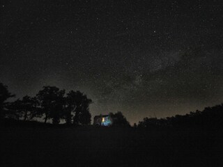 House under starry sky
