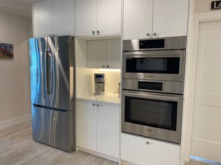 coffee bar, refrigerator, oven , microwave