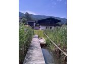 View of lawn and house from private bathing jetty