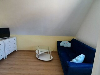 Wohnbereich OG mit Sofa und TV
