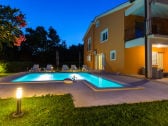 Pleasant summer evening by the pool