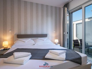 Bedroom 2 with double bed and TV