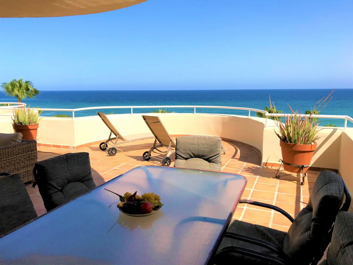 large covered terrace with frontal seaviews