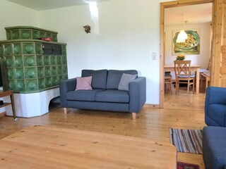 Living room with tiled stove