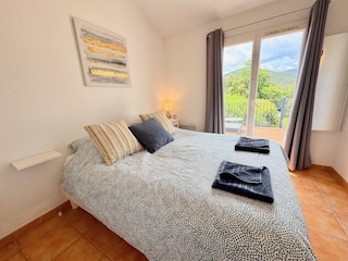 master bedroom with doors to terrace