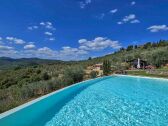 view from pool to house and apartment