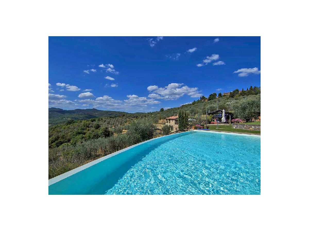 view from pool to house and apartment