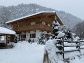 Chalet bei Schneefall