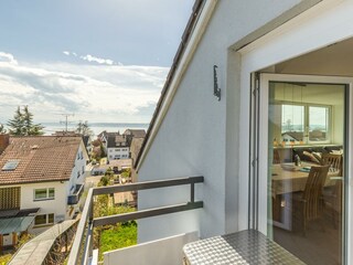 small balcony with lake and alpine view