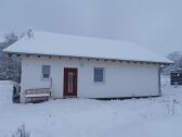 The house in a snowy winter.