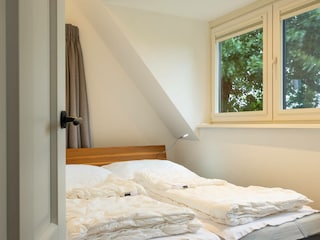 Das dritte Schlafzimmer mit Doppelbett