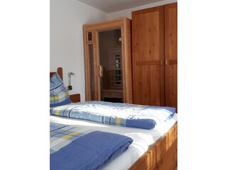 Wooden infraredsauna in the bedroom
