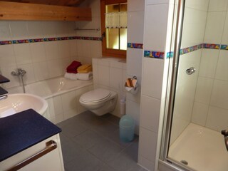 Bathroom with bathtub and shower