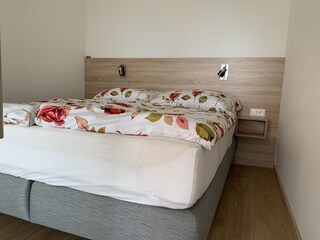 View of the bedroom (wiht high-quality box spring bed)
