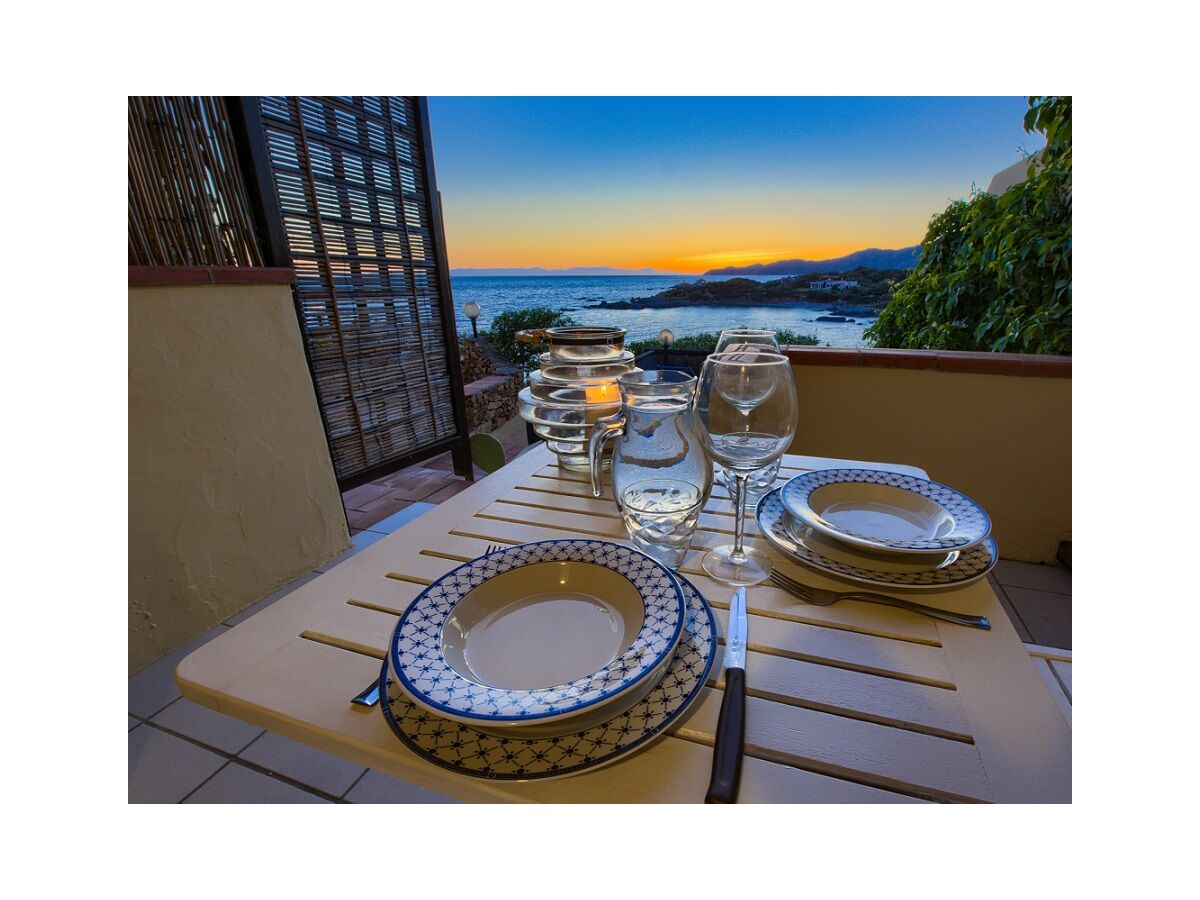 Waterfront veranda in front of sunset