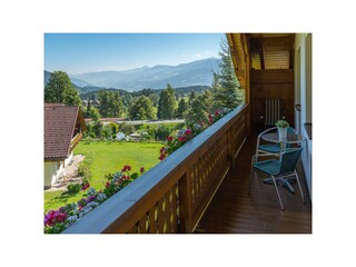 Large wooden balcony with view of the mountains