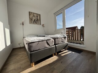 Schlafzimmer mit Balkon