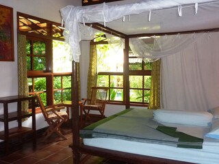 one of the rooms in the large bungalow