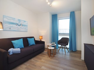 Gästezimmer mit Luxus-Schlafcouch und TV