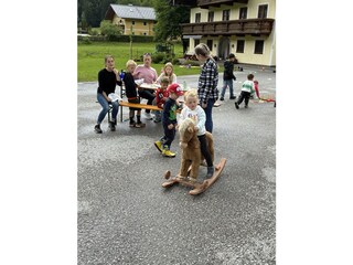 Children hav fun in front of the house