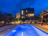 Carefully set lights around the pool and dining area