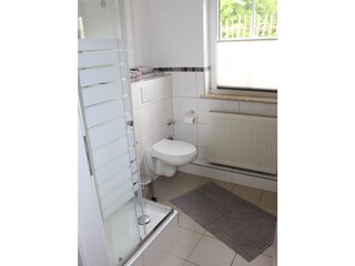Bathroom with shower, toilet and sink