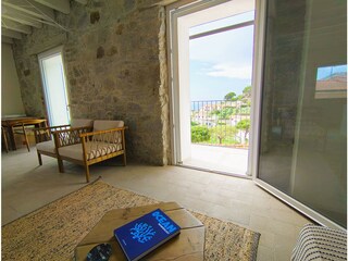 living room with terrace and sea view