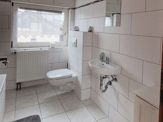 1st. Floor bathroom with bathtub, sink and toilet