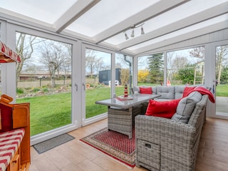 Wintergarten mit Strandkorb