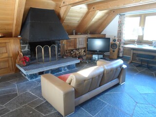 Livingroom with large fireplace /TV