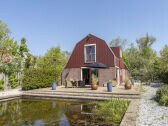 cottage with large pond