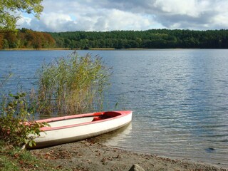 With the fishing boat on the lake