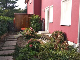 Entrance area with wood storage.
