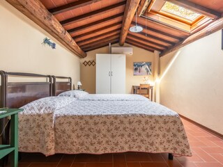 Bedroom in the attic with twin beds or double bed