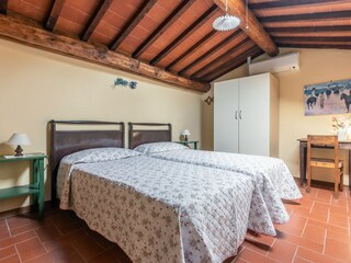 Bedroom in the attic with twin beds or double bed