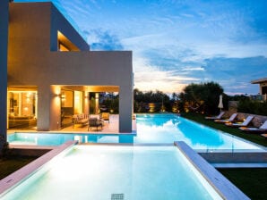 Lush villa with Heated Pool 180m to the Beach - Platanias - image1