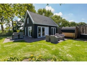 Holiday house Family house with an ideal location, private terrace, garden and sauna - Vrouwenpolder - image1