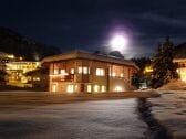 house in winter during full moon