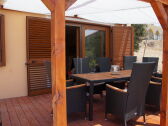 Terrace with awning and glass roof