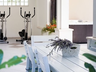 2 orbitrack fitness devices nex to the jacuzzi