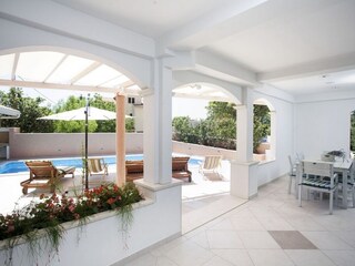 Covered terrace with dining area for 8 pax