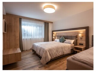 Söll_APARTdeluxe_Penthouse_Schlafzimmer_WilderKais