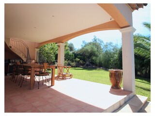 Outside dining table connected to kitchen