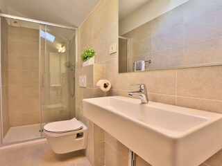 A family bathroom with a shower