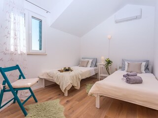 A Bedroom No2 with two single beds 90cm x 200cm, AC